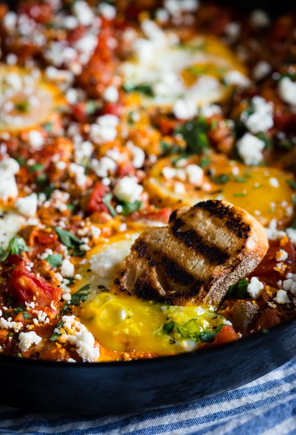 This feta chickpea shakshuka is the perfect breakfast, brunch or dinner recipe. It's packed full of protein and flavor and ready in just 35 minutes! Plus, it reheats beautifully and perfect when paired with crusty grilled bread.