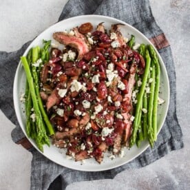 This grape and blue cheese flank steak is the perfect romantic meal and it's ready in JUST 30 minutes! Herb marinated flank steak cooked on the stovetop and topped with balsamic sautéed grapes and shallots and sprinkled with blue cheese - what's not to love?