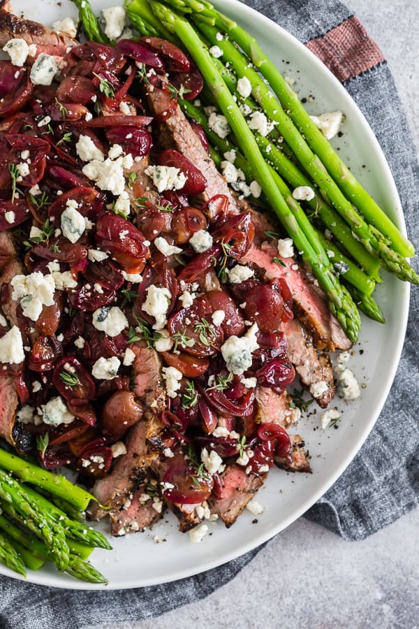 Grape and Blue Cheese Flank Steak with asparagus.