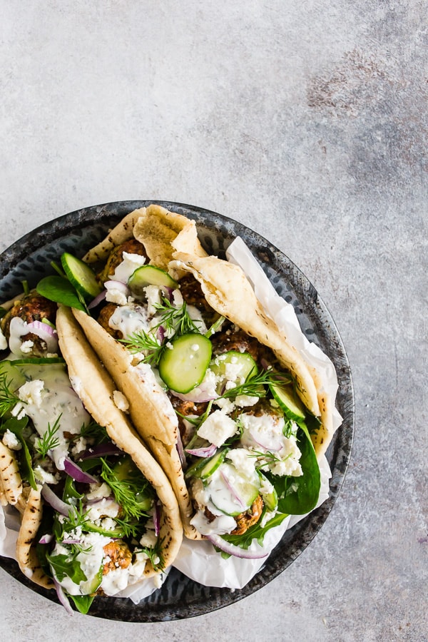 Greek Chicken Meatball Gyros on a plate.