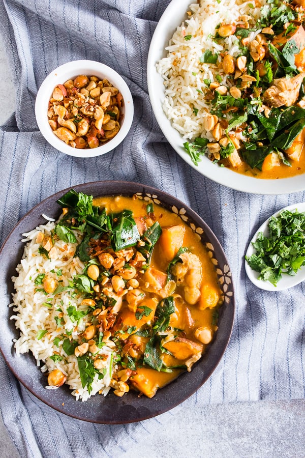 African Chicken Peanut Stew served in a bowl with rice. 