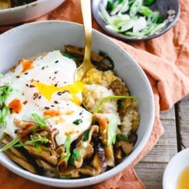 This savory Asian oat bran is simmered with spices and topped with sauteed shiitake mushrooms, fried eggs and garnished with sriracha. It's the perfect savory breakfast twist to traditional oat bran. Plus, not only does it make a great breakfast but it's also great for lunch or dinner!