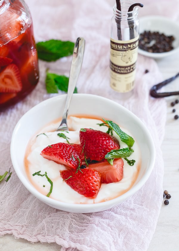 Pickled strawberries served over yogurt. 