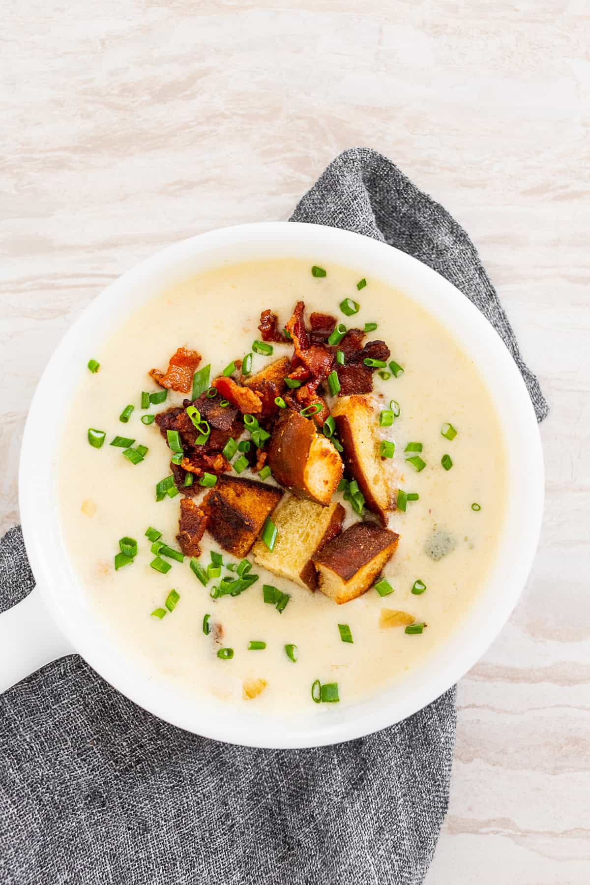 Beer Cheese Soup topped with croutons, chives, and bacon. 