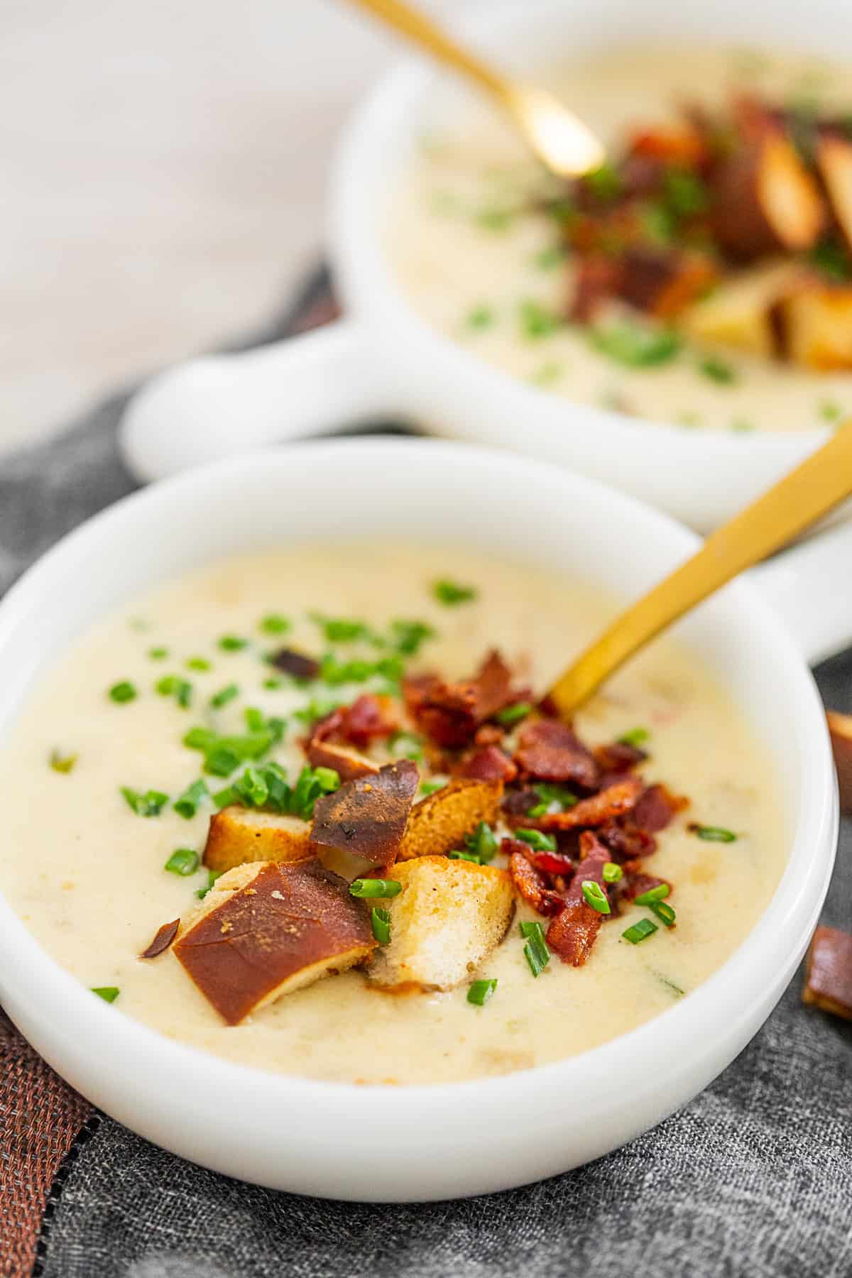 Beer Cheese Soup in a bowl with a spoon. 