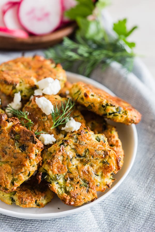 Greek Zucchini Fritters on a small white plate.