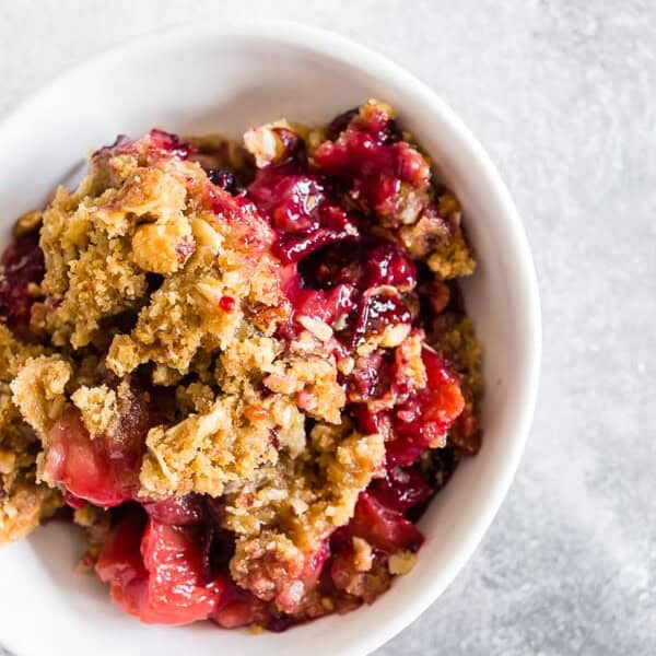 This cardamom vanilla plum crisp is filled with juicy plums and topped with a crunchy oatmeal hazelnut topping. It's the perfect sweet treat to end the day with a perfect hint of vanilla bean and cardamom flavor. 