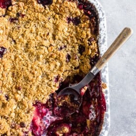 This cardamom vanilla plum crisp is filled with juicy plums and topped with a crunchy oatmeal hazelnut topping. It's the perfect sweet treat to end the day with a perfect hint of vanilla bean and cardamom flavor. 