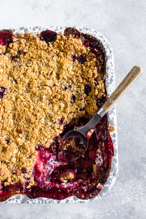 Cardamom Vanilla Plum Crisp in a baking dish. 