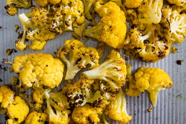 This super simple roasted orange cauliflower is the perfect side dish vegetable. Plus the deep orange color is not only pretty but it provides more Vitamin A than typical cauliflower. It's healthy, delicious and can be used in place of any traditional cauliflower recipe. 