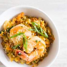 This spicy shrimp egg roll skillet is the quick and easy weeknight meal you need! It's packed full of napa cabbage, carrots, garlic, ginger, and spicy shrimp. It's ready in just 30 minutes and packed full of flavor! 