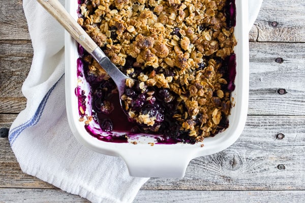 This blueberry rhubarb crisp is the perfect way to celebrate the bounty of summer. Sweet blueberries paired with tart rhubarb and topped with a crunchy rolled oat topping. It's delicious eaten warm and even better when topped with ice cream or whipped cream. 