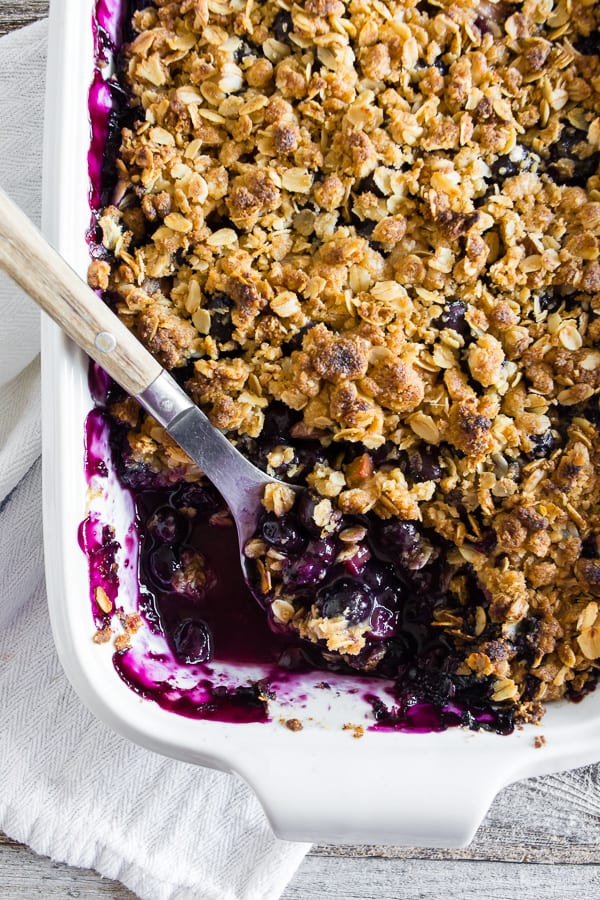 This blueberry rhubarb crisp is the perfect way to celebrate the bounty of summer. Sweet blueberries paired with tart rhubarb and topped with a crunchy rolled oat topping. It's delicious eaten warm and even better when topped with ice cream or whipped cream. 