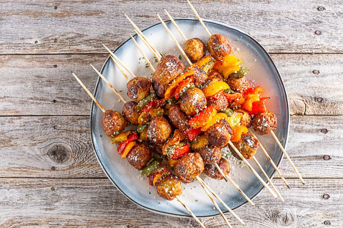 Grilled Chicken Meatball Skewers on a small plate. 