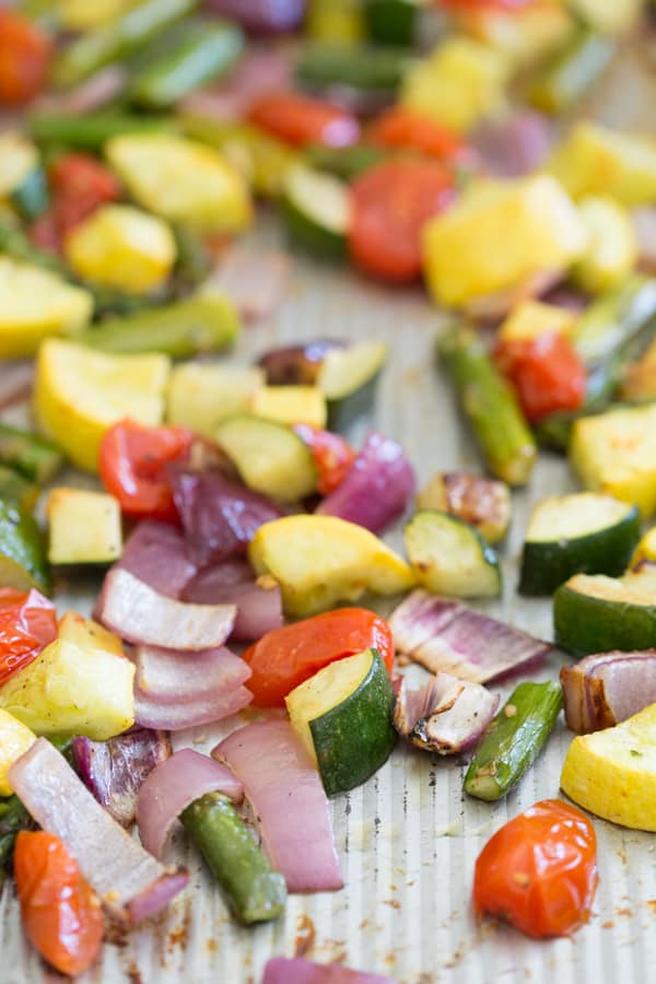 Roasted vegetables on a sheet pan. 