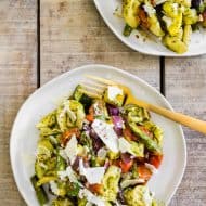 This roasted vegetables tortellini salad is the perfect way to use up all those summer vegetables. Perfectly roasted vegetables mixed with cheese tortellini and tangy basil vinaigrette mixed together and sprinkled with shaved Parmesan cheese. You'll love this easy salad! 