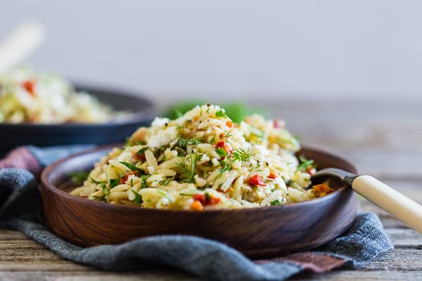 Mediterranean Tuna Orzo Salad on a small plate with a fork.