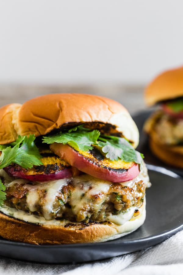 Cheesy Grilled Peach Jalapeno Turkey Burger served on a soft bun. 