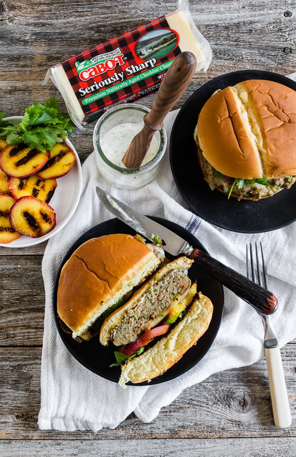 Cheesy Grilled Peach Jalapeno Turkey Burger cut in half. 