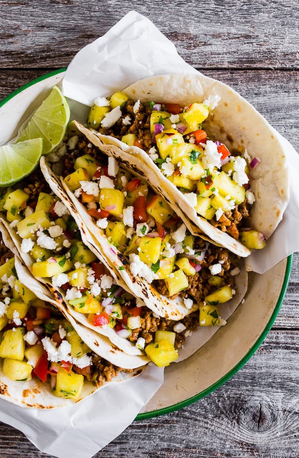 These ground pork tacos with pineapple salsa are the perfect mix of spicy and sweet. They're perfect for a quick weeknight dinner or an easy weekend meal. You'll love all the flavor packed into these tacos!