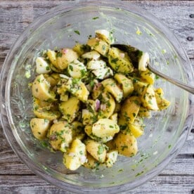 This honey mustard potato salad can be served warm or cold but the best part is that it's mayonnaise free, packed full of herbs and just the right amount of whole grain mustard and natural honey. It's a fun twist to traditional potato salad and you'll love the sweet and savory combination. 