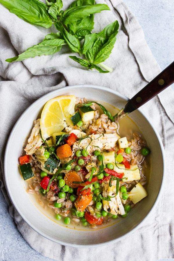 Lemon Chicken Vegetable Farro Soup in a ceramic bowl.