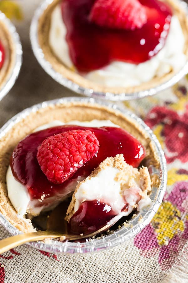 These no bake raspberry lemon mini cheesecakes are going to be your new favorite summer dessert. Lots of big time lemon flavor packed into a creamy cheesecake mixture and topped with raspberry jam and fresh raspberries. It's the perfect mixture of sweet and tart!