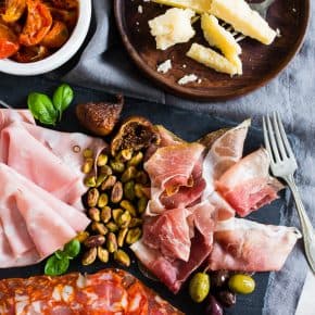 This Italian salumi board is the perfect combination of delicious imported Italian meats, imported Italian cheese, nuts, dried fruit, olives, roasted tomatoes, pickled vegetables and grilled bread. It makes a great appetizer or a simple summer meal - no cooking required!