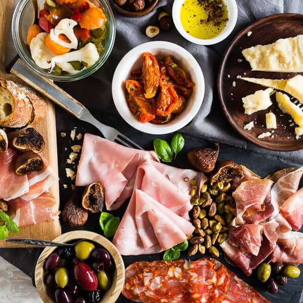 This Italian salumi board is the perfect combination of delicious imported Italian meats, imported Italian cheese, nuts, dried fruit, olives, roasted tomatoes, pickled vegetables and grilled bread. It makes a great appetizer or a simple summer meal - no cooking required! 