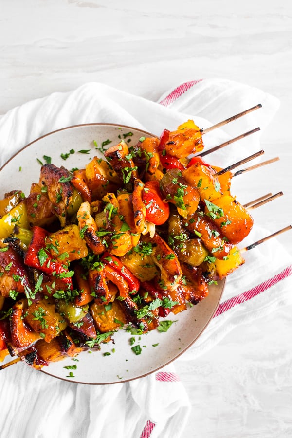 Pineapple Chicken Kebabs sprinkled with parsley. 
