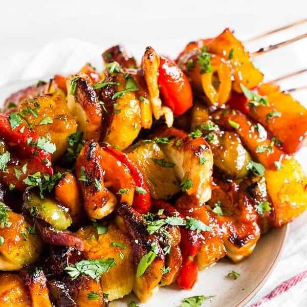 These BBQ Hawaiian chicken kebabs are packed full of flavor and the perfect grilling recipe. Chunks of chicken breast paired with bell pepper, red onion, pineapple and glazed with tangy BBQ sauce - what's not to love? 