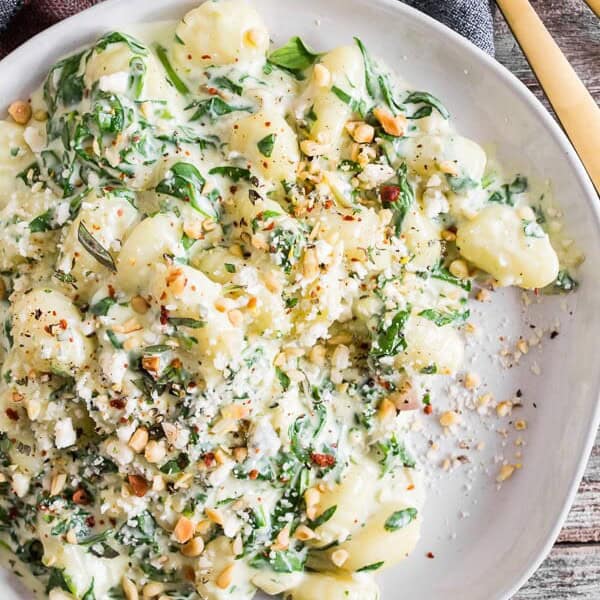 This creamy gorgonzola gnocchi with baby spinach is topped with toasted pine nuts and just a sprinkle of Parmesan cheese. It’s the perfect creamy dish for Meatless Monday or throw on a little grilled steak to take it to a whole new level of protein packed deliciousness. Trust me, you’ll love how easy it is to make this flavorful dish!