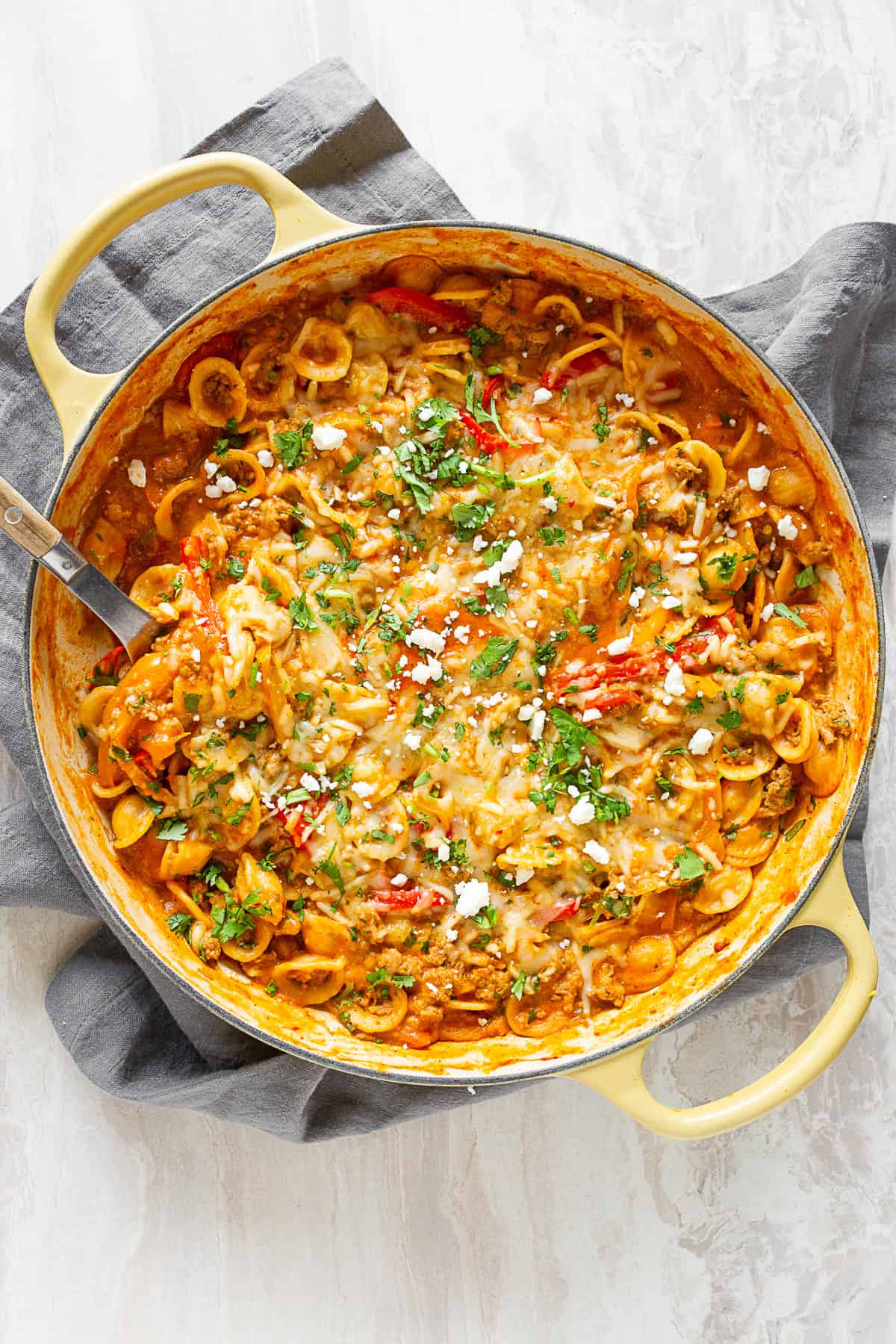one pot ground chicken fajita pasta in a yellow cast iron skillet