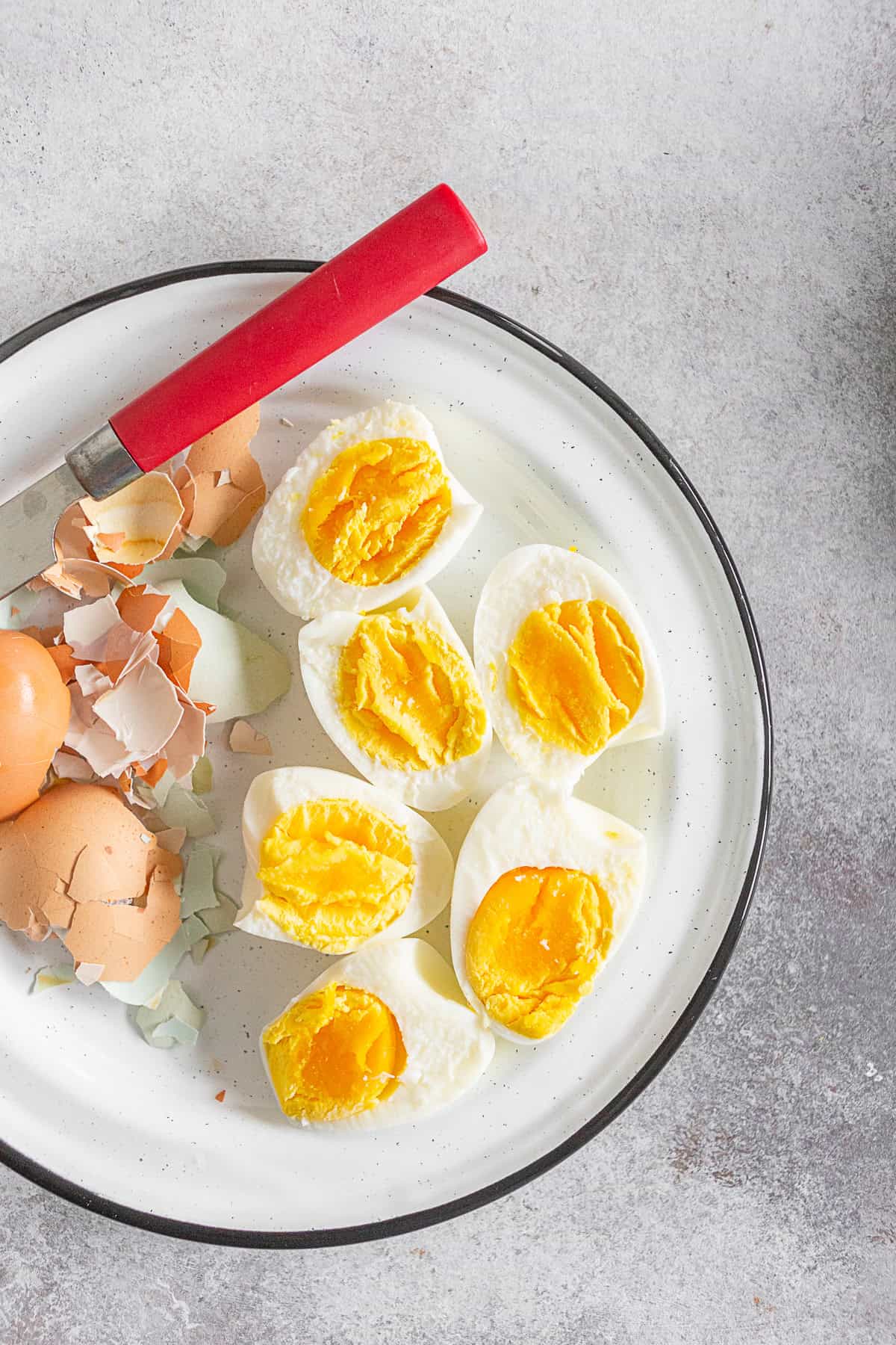 Instant Pot Hard Boiled Eggs peeled on a plate. 