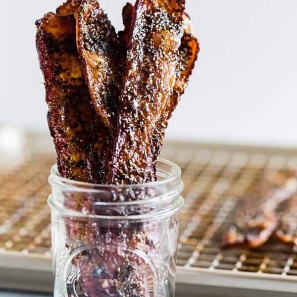 This maple black pepper bacon is the perfect balance of sweet and savory. Eat it as a midday snack or sneak a few bites as a midnight snack. Made with maple syrup, maple sugar and a lot of fresh cracked black pepper. You'll love these crispy little bites. 