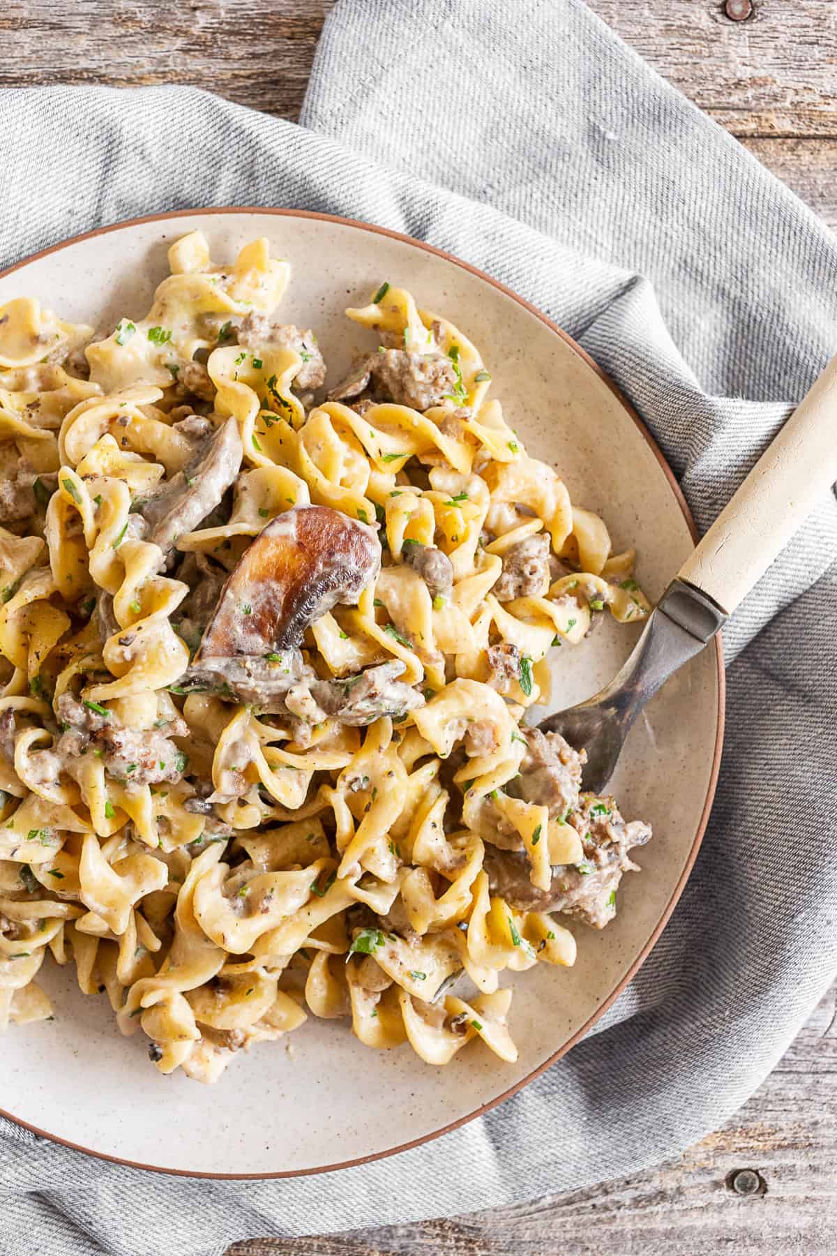 One Pot Beef Stroganoff on a plate with a fork. 