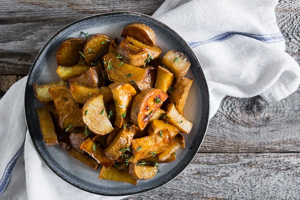 Roasted White Sweet Potatoes on a serving board. 