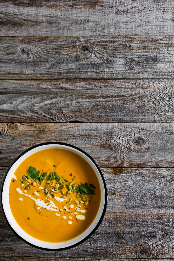 Spicy Thai Pumpkin Soup sitting on a table. 