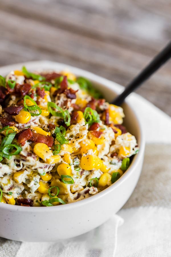 Creamy Bacon Jalapeno Corn Dip in a white bowl.