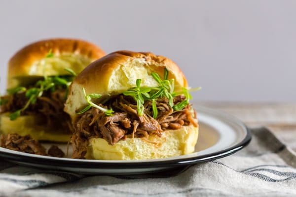 Instant Pot Cranberry Sauce Pulled Pork on a potato bun.