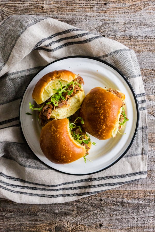 Instant Pot Cranberry Sauce Pulled Pork served on a bun.