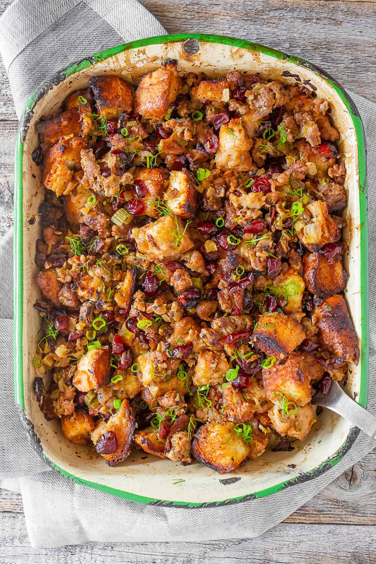 Texas Toast Stuffing in a try with a serving spoon. 