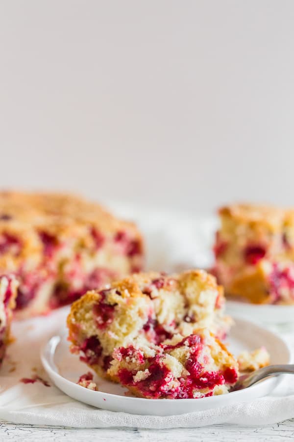 Vanilla Cranberry Buttermilk Cake on a plate with a fork.