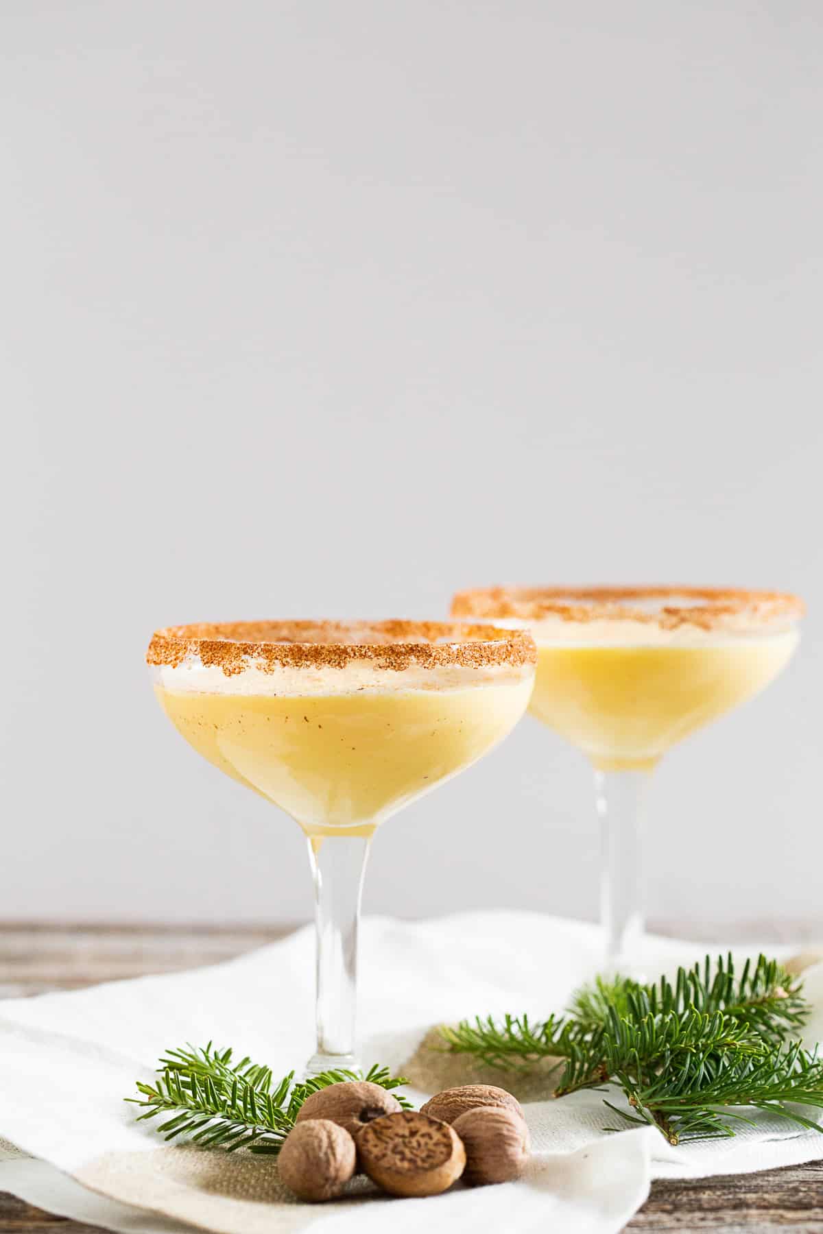 eggnog martini in a glass topped with nutmeg