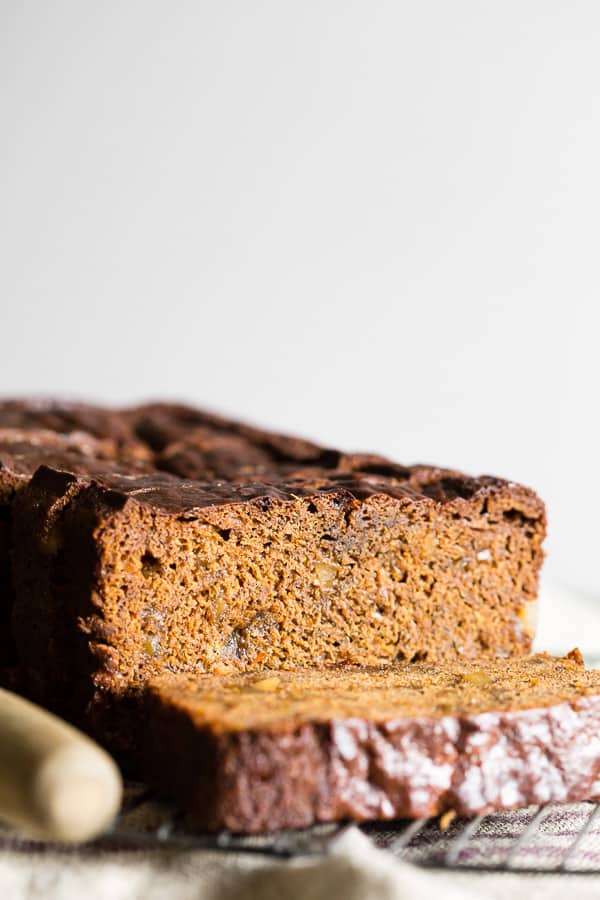 Gingerbread Banana Bread sliced on a cooling rack.