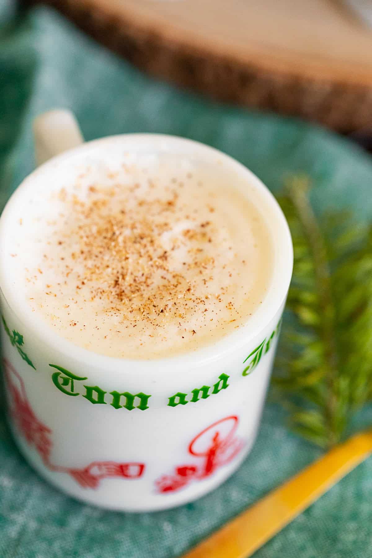 Tom and Jerry Cocktail Recipe topped with nutmeg.