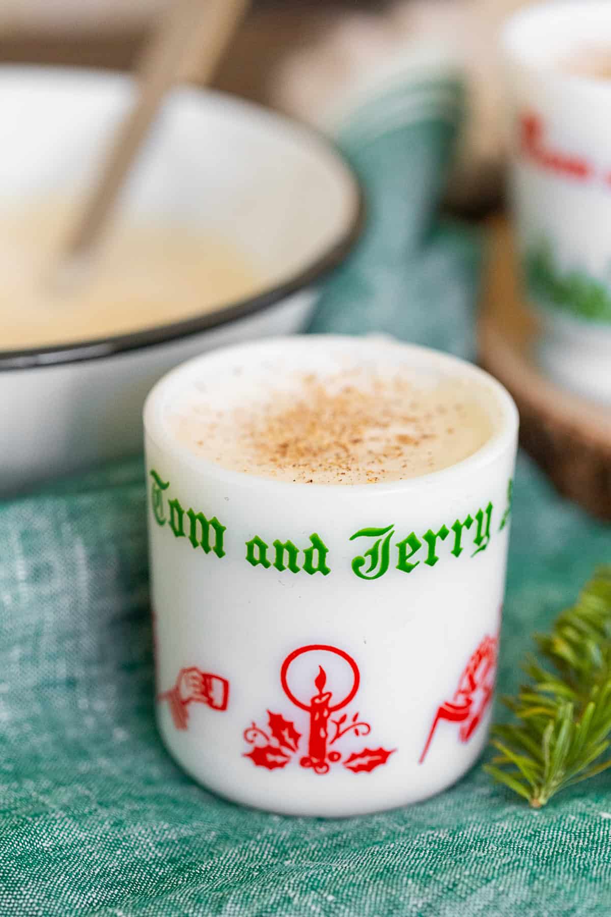 Tom and Jerry Cocktail Recipe topped with grated nutmeg.