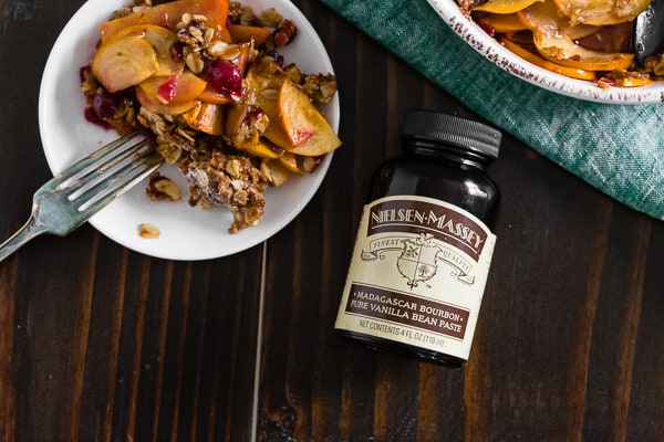This vanilla bean persimmon crisp is the perfect holiday dessert. It's made with thinly sliced seasonal persimmons, chopped fresh cranberries, vanilla bean paste and topped with a homemade vanilla oat and almond mixture. You'll love this simple winter dessert!