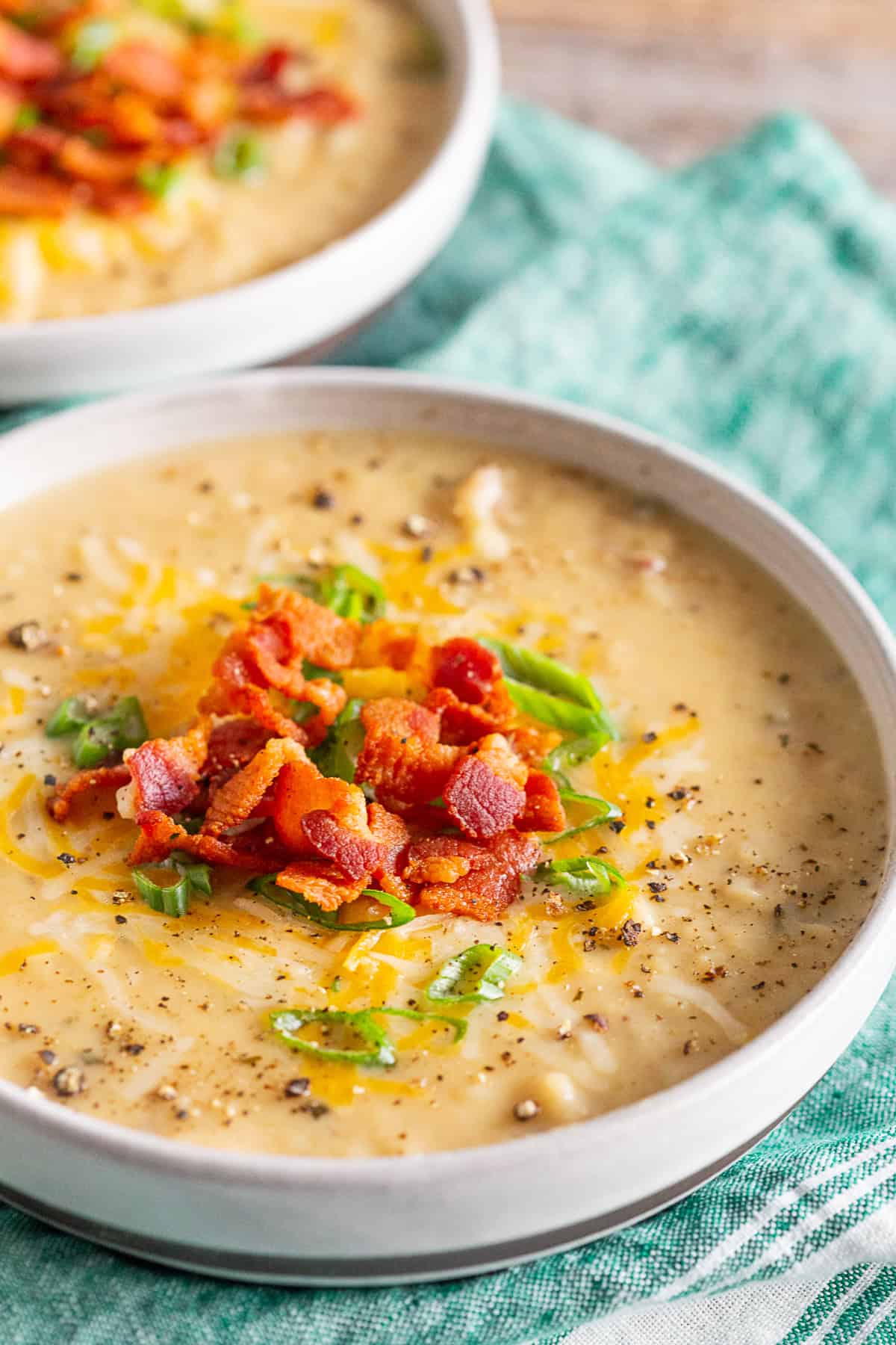 Loaded Baked Potato Soup topping with bacon.