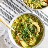 This Peruvian chicken soup (aka: aguadito de pollo) is a delicious winter soup full of rotisserie chicken, rice, vegetables, and LOTS of cilantro. Super simple to make and ready in just an hour. It's the perfect weekday or weekend soup! 